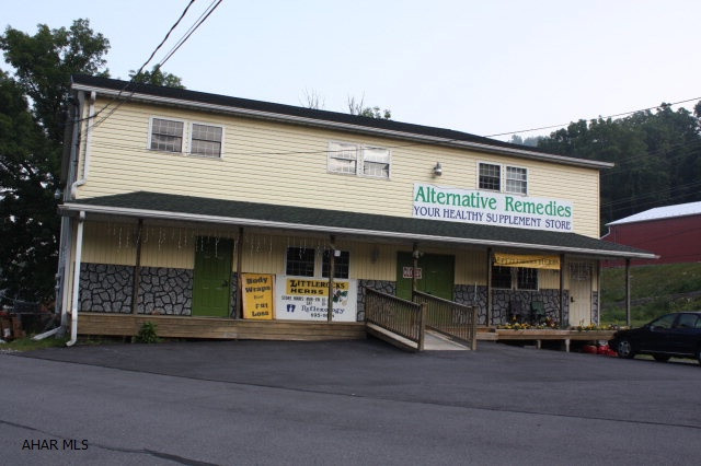 Investors and Entrepreneur's don't miss this oppertunity.  There are already 3 business's and one apartment rental generating income. There are 2 ready and waiting units and a lg 2 car deep garage with office to be rented.  With a little remolding the 2nd floor can be turned into 2 apartments instead of 1 for another income source.  Private well has a new purifying system on for Restaurant use.  Units have separate electric, heat and central air.  There is plenty of parking with 3 parking lots of which one is paved, other 2 are gravel.  Endless opportunity and great exposure right along Rt 36.