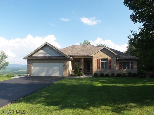 This ranch home is located in the highly sought after Laurel Heights development in Warriors Mark, central to Altoona and State College.  Upon entering, the spacious foyer featuring hardwood floors welcome you as you look thru the formal dining and living rooms to glimpses of the panoramic valley views to come.  Convenient main floor laundry has cupboard space and a pantry.  The eat-in, island kitchen offers an abundance of cabinet space and two pantrys, all appliances are included.  This opens to the sun room and the deck with magnificent views of Warriors Mark Valley.  Spacious bedrooms each with closets and the Master bedroom suite with a walk-in and linen.  The partially finished basement offers many possibilities and leads to a patio.  Don't miss this one of a kind, immaculate home!