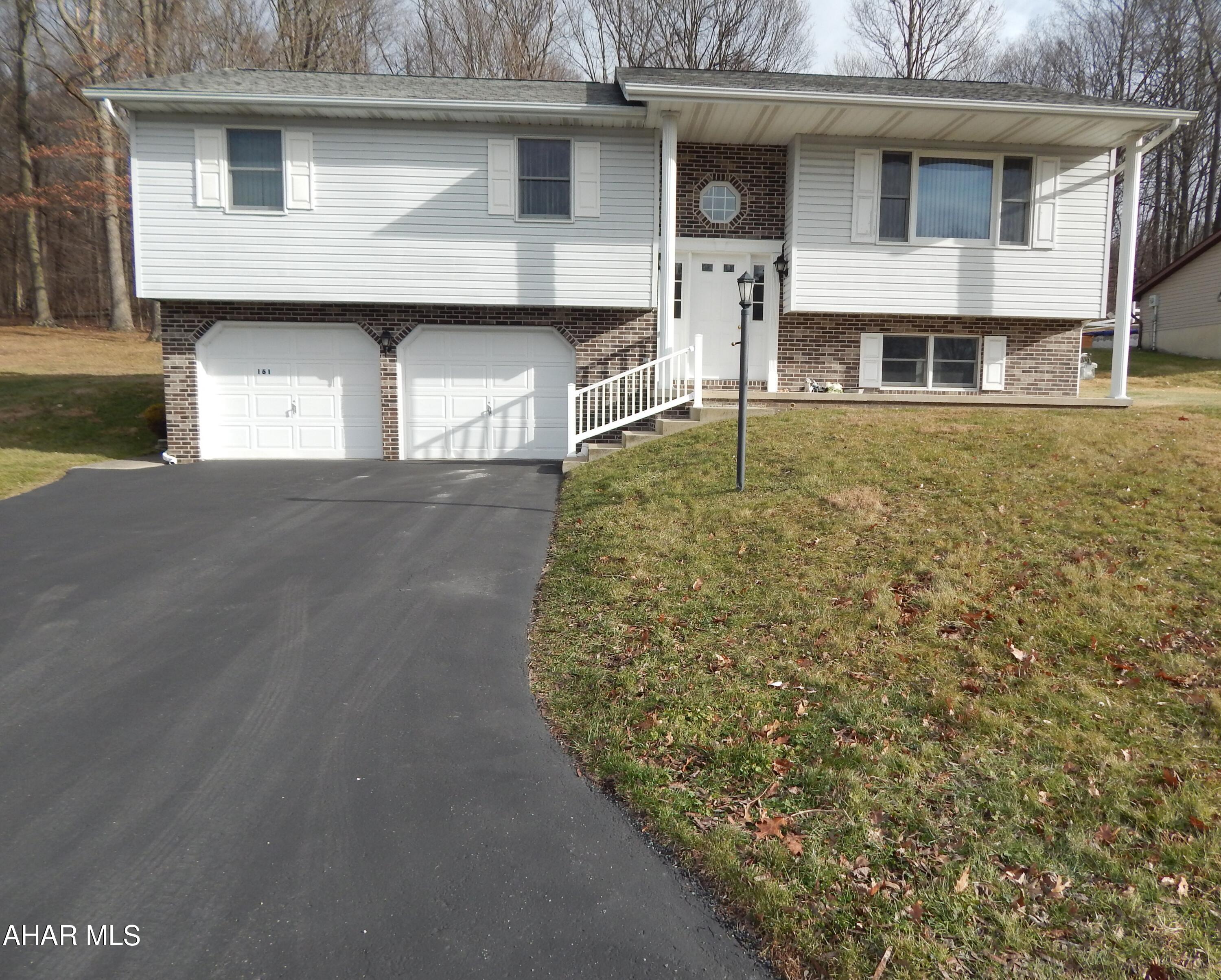 This spacious split level home features three restful bedrooms and three full baths, including a sought-after master bedroom suite conveniently located on the main floor. The home offers a generous eat-in kitchen and has been well-maintained with a newer central A/C unit installed in 2024 and a new water heater installed in 2025. Perfectly situated on a peaceful cul-de-sac, the property also includes the convenience of off-street parking with a paved driveway leading to a 2-bay integral garage, providing both secure parking and extra storage.