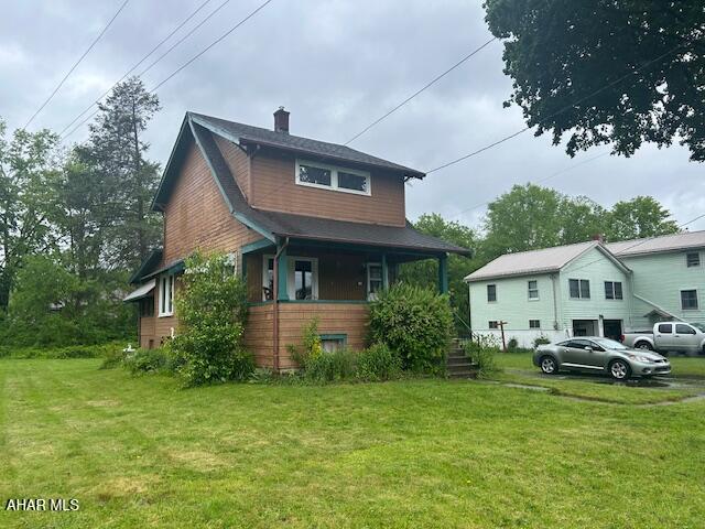 Cute 1 1/2 story home on a large .24 city lot.  2 BR & 1 bath  Large enclosed sunporch off the kitchen. Wood floors.  Off street parking.