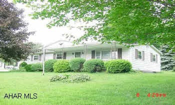 Ranch,  full basement w/ family room,  2 Car detached garage on large corner  lot in Cambria Heights School District This cute ranch has so many possibilities.  Great yard for children, large family room, pool table, nice covered front porch & sun room in back, large 2 car detached garage, private well, oil hot water heat .