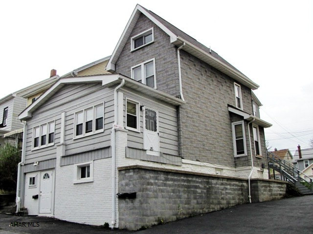 Great opportunity to invest in a 3 unit property. Off street parking for 6 vehichles. Live in one unit and rent out the other two. Tenants pay their own electric. Main floor is wheel chair accessible. Nice double lot. Newer furnace.