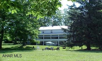 From Roaring Spring to Martinsburg Lite continue Straight (Rt 164) approx 4 miles.  R Henrietta Rd-Approx 3 miles L on Ore Hole Rd.  L 2nd Driveway.  Gorgeous peaceful setting nestled in the pines.  Pond, View.  Look at additional photos #J-818. From Roaring Spring to Martinsburg Lite continue Straight (Rt 164) approx 4 miles.  R Henrietta Rd-Approx 3 miles L on Ore Hole Rd.  L 2nd Driveway.  Gorgeous peaceful setting nestled in the pines.  Pond, View.  Look at additional photos #J-818.