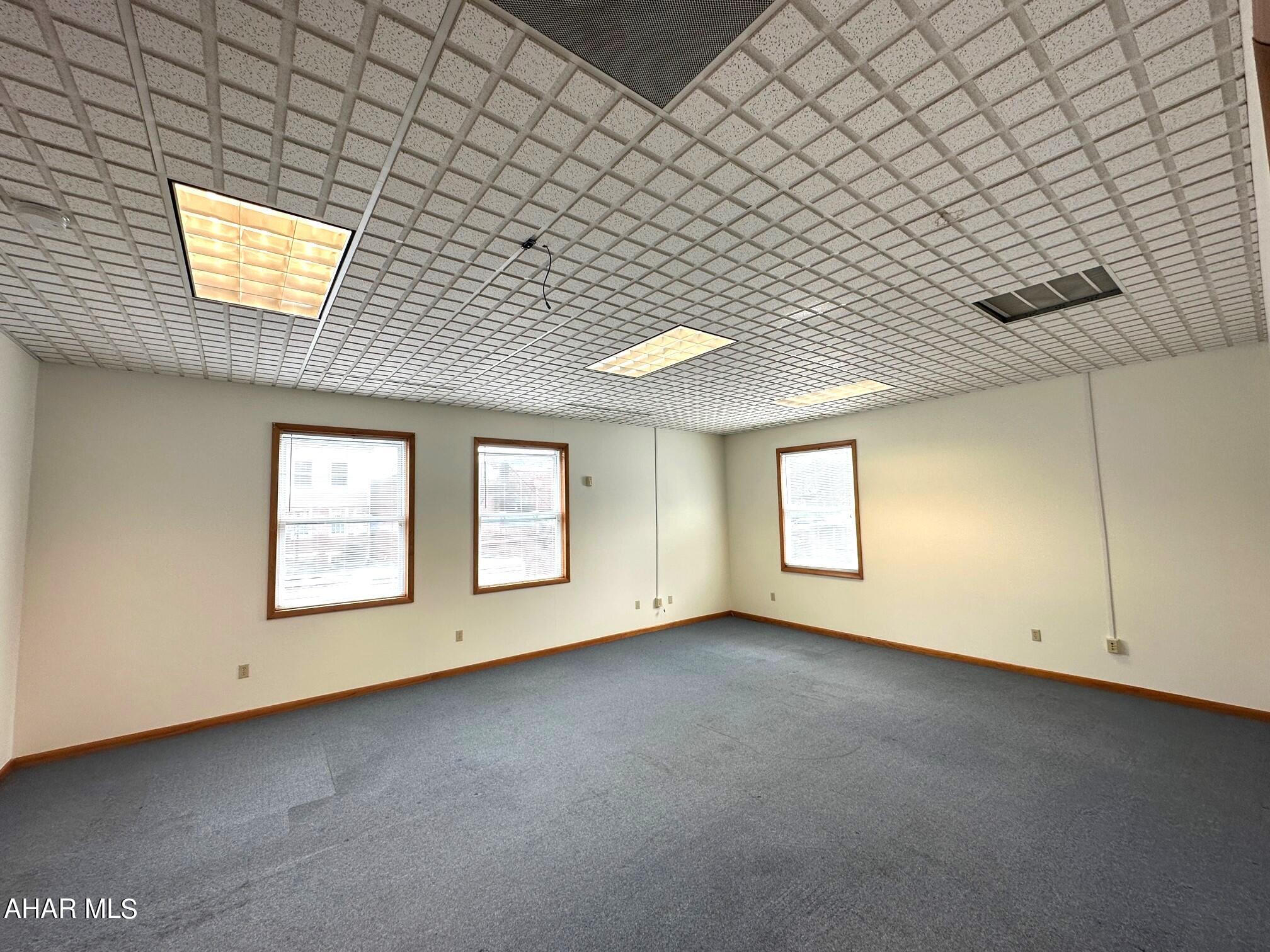 Modern professional office space for lease in downtown Bedford! This is suite 3 and it contains 950 square feet. This space can be divided and contains one large office, a private office, kitchen and another office area. This is second floor space that is all ADA accessible with an elevator for easy access. Rent is $975 per month and includes all utilities. Multi-unit building with other tenants in place.