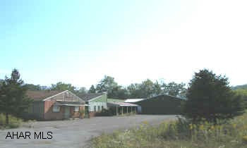 Former JG Packing plant, refrigerator space, warehouse space, work area, and dressing area. Warehouse addition approx. 20 +/- years old. Combination heating.