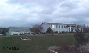 Beautiful raised ranch in mush sought after country location. This home has it all. Living room, kitchen, dining room, three bedrooms, and two baths located on the main level. Finished lower level with den, family room, kitchen, and half bath. Professional interior decor. A large, level, open running yard for the family. A beautiful buy. Also has wood burner. Central exhaust fan.  Plus 1 car integral garage and 2 car detached.