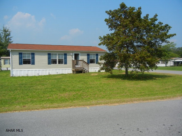 Like new 2006 Skyline doublewide in Camelot Woods mobile home community.  Three bedrooms, two baths.  Large corner lot.  Driveway.  Lot rent includes sewer and trash. Doublewide can be moved as well. Priced to sell!