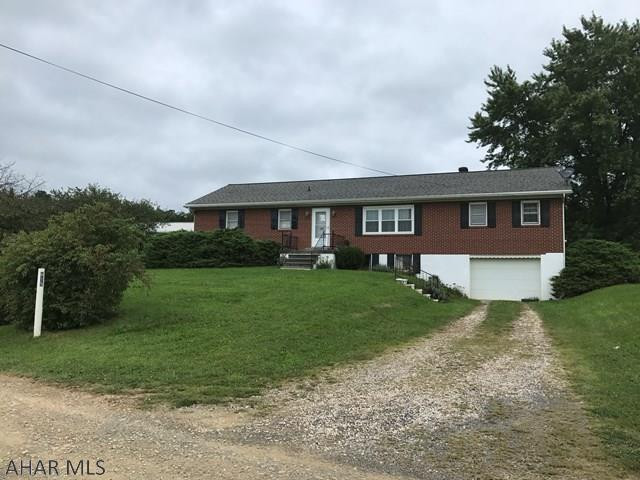 Brick home on almost 1 acre.  Views that are stunning.  Four bedrooms, large rooms, finished basement with a kitchen, family room, bedroom and 3/4 bath.  One car integral garage and a 40x60 detached garage with separate 100 amp electric service, lighting and welding hook up.