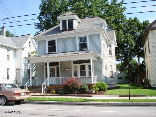 Very nice older home with lots of charm and character.  Hardwood floors on all levels of the home, natural woodwork on the main level, pocket doors between living room and dining room, large kitchen, half bath on main level, nice enclosed back porch, 3 large bedrooms and one bonus/bedroom (no closet), really cute bathroom with mosaic tile flooring, walk-up attic could be finished for additional living space.  A nice size yard and a one car garage complete this home.