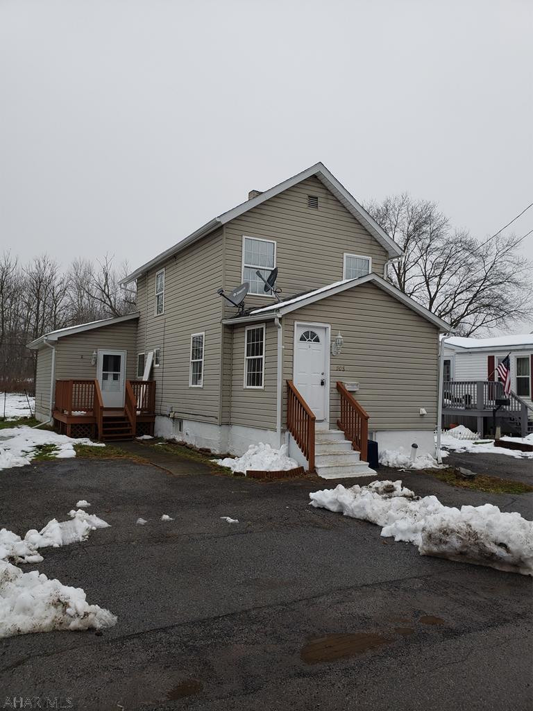 Super value in the heart of Bellwood!  Property features included vinyl siding, wrap-around deck, newer windows, flat fenced yard and off street parking.  The interior features muted tones, laminate, and ceramic tile flooring, and recessed lighting.  The property features a newer furnace (6 years), central air (4 years) and hot water heater (2 years).  The unique layout of this home will make entertaining a breeze.  Additional features include a first-floor bedroom, full bath, and laundry room with included washer and dryer.  Priced to sell, please call the listing agent today to schedule your private showing of this property!