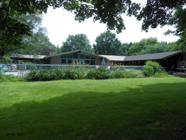 Wonderful sprawling Ranch home with over 3,000 sq. ft. of living space on main level. Lots of natural light, cathedral ceilings. Great pool house and covered patio w/ bath, changing room and kitchen area. Privacy at its best and terrific home for entertaining! 22x40 in ground heated pool add for summer fun!