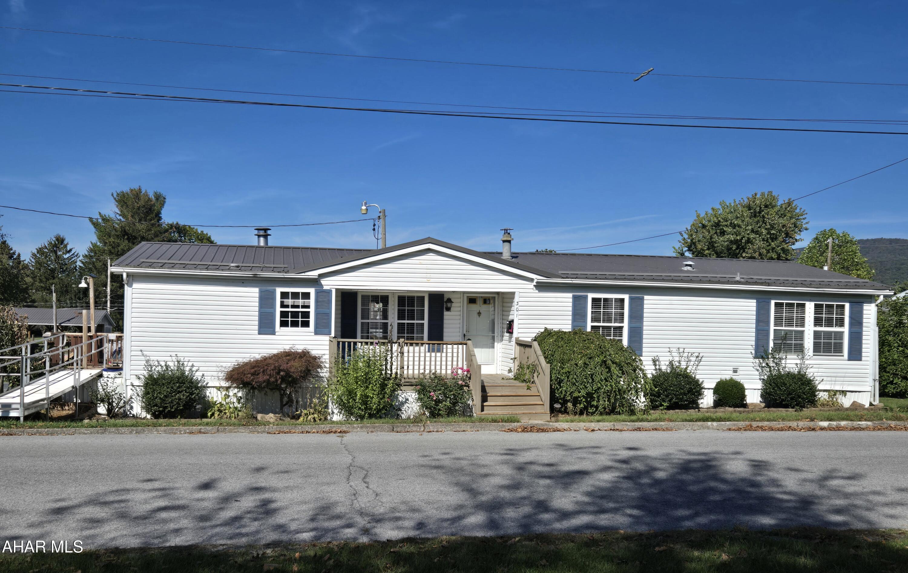 Well kept 1993 3-Bedroom 2.5-Bath Champion mobile home with ramp access, metal roof + shed in the Borough of Martinsburg. Spacious Primary Bedroom ensuite. 2 bedrooms have walk-in closets. Eating area in Kitchen & also Dining Area open floor plan off Living Room with fireplace. J-674