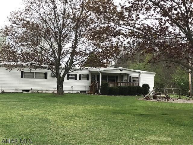 Adorable 3 bedroom, 1  bath home with additions on a full foundation.  Beautiful location with a one car garage, outbuildings and a large yard.