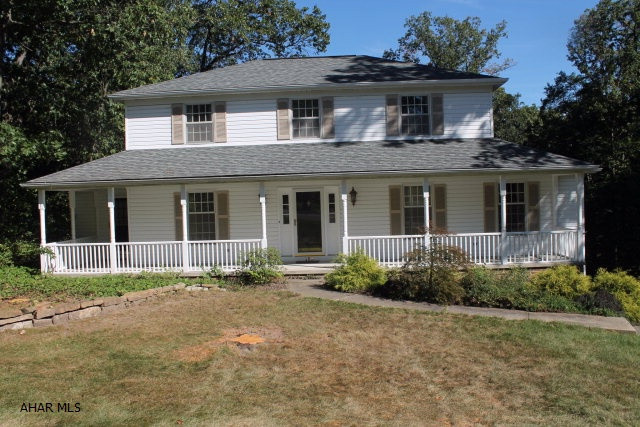 From the welcoming front porch, inviting and well proportioned rooms paired with hardwood floors its not hard to imagine why it's the perfect place for you.This lovely 3 bedroom ,2.5 bath home is located in beautiful Stonehedge .This home sits on 1.5 acres with a gorgeous in ground pool with wooded tree line. Heat economically with natural gas.2 car garage.. This a like new home without the wait..