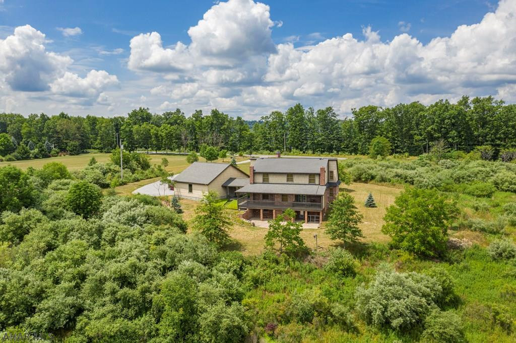 Custom-built brick 3 bedroom, 3 bathroom home on 3.6+ acres adjacent to 7,651 acres of State Game Lands (SGL120). Enjoy breathtaking mountain views from the deck. Store all the toys in the oversized two car garage. Relax in the open concept great room with rustic hickory beams and brick accent. Finish the walkout basement for more living space. The possibilities are endless with this immaculate, well-maintained home that has barely been lived in. A secluded setting but also close to local amenities and Rock Run Recreation Area with over 140 miles of trails and also Prince Gallitzin State Park containing 1,635 acre Lake Glendale. A 1.37 acre subdivision possible. City water. Don't miss this one. Check out our 3D virtual tour and property video.
