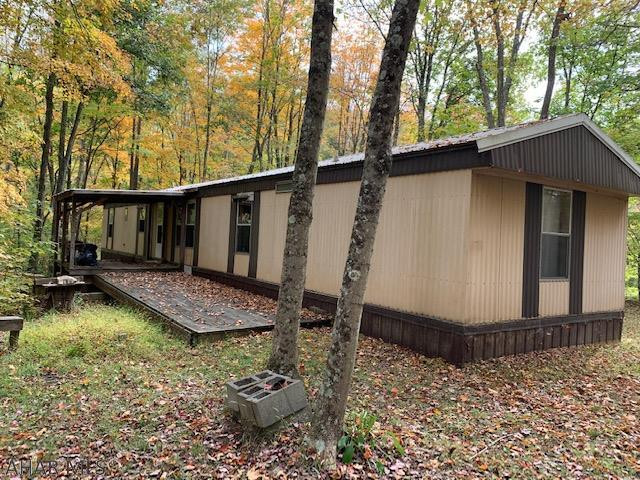 Hunters Paradise on 56+ acres of wooded land!  Abundance of wildlife, deer, turkey, and bear!  14x70 1985 trailer offers a battery powered electric, septic holding tank and is heated with propane. New laminate floor was installed in part of the trailer. Well is hand dug.  Piney Creek year around creek.  Nice tree stand on the property at the top of the property. Seller believes mineral rights convey, a title search will help determine they do.  Their is an Oil and Gas Lease ROW on the property and no gas stored on the property.
