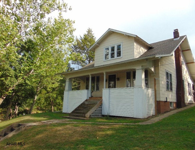 This great home is situated just outside of the town of Everett with a private front yard.  It offers large spacious rooms with high ceilings and hardwood floors throughout. In addition to 3 bedrooms on second floor, the first floor also has two bonus rooms that could be used as additional bedrooms! Bathrooms are located on both floors, with a first floor laundry too! Enjoy your time at home with two covered porches and a fire pit area. Also a pellet stove as an additional heat source!