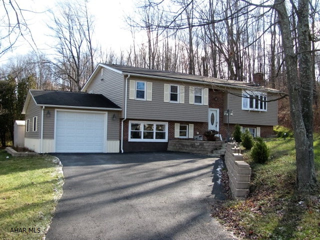 Spacious Brick & Vinyl Bellwood Bi-level!! Conveniently located just 15 minutes from Altoona and 30 minutes from State College with easy access to I99!! This home offers a Lg LR w/fireplace and bay window, EIK w/Ceramic tile flr and stainless appliances, 3 bedrooms plus a LL family room space and 2 bonus rooms! Newer roof, siding, windows and furnace!!