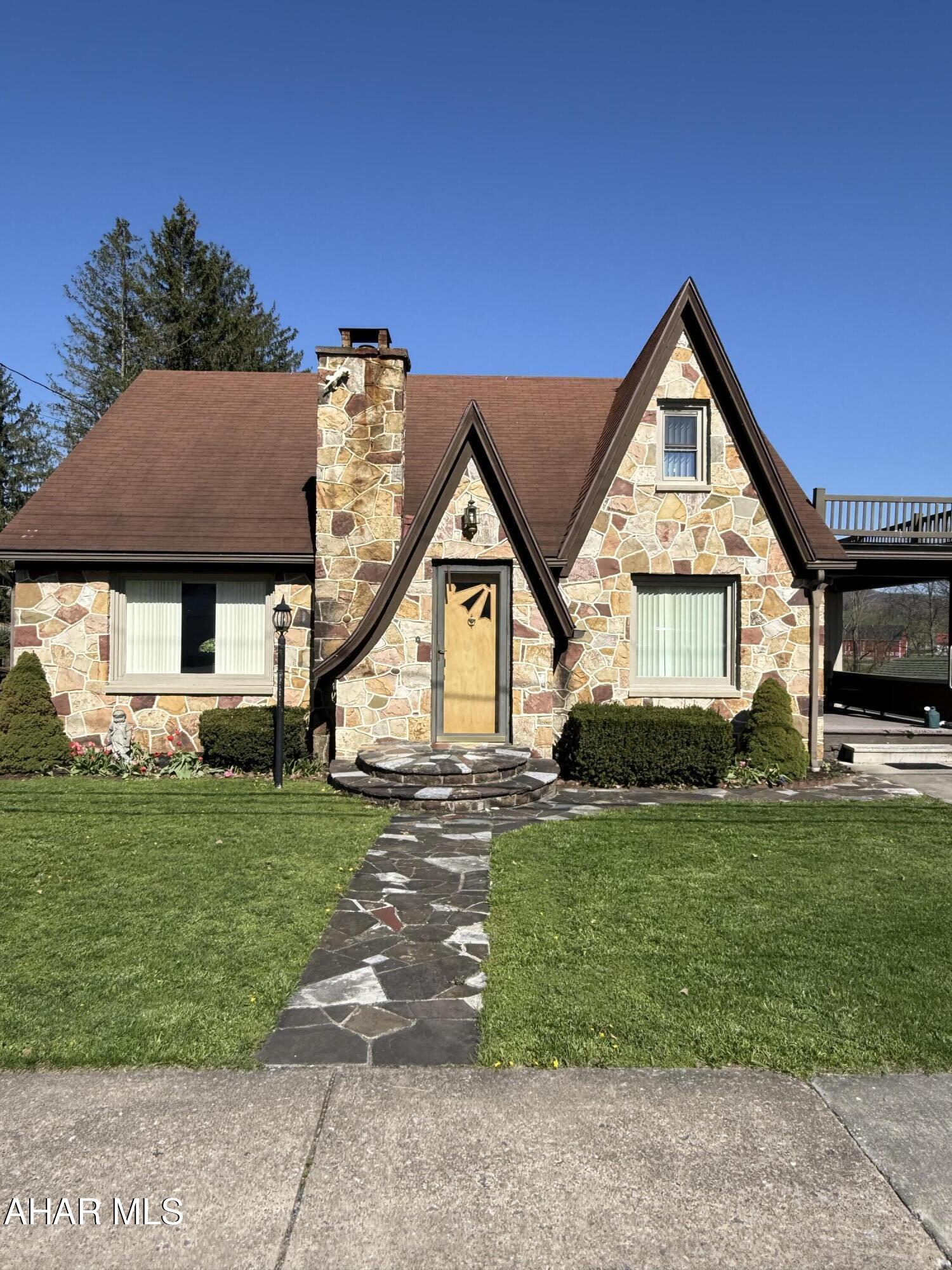 Welcome to 3987 Cortland Drive! This exquisite stone home is located within the Chestnut Ridge School District. The expansive backyard is ideal for entertaining featuring a large garden and a stream at the edge, perfect for fishing or skipping rocks. A spacious side porch entrance provides a comfortable space to relax and unwind. Inside, the eat-in kitchen includes a sit-up bar, a desk area, and ample counter space. The refrigerator, range/oven, microwave and dishwasher are included. The also offers a pantry and abundant cabinet storage, accompanied by a dining area. Adjacent to the kitchen is a versatile den, suitable for use as a playroom, gym, or additional living area. The first-floor master bedroom features a full bathroom and double closets. The expansive living room is bathed in natural light. On the second floor, there are two bedrooms, a half bath, and a cedar closet. The basement includes wash tubs, a washer, dryer, walkout access, and generous storage space. Convenient situated near medical offices, schools, and local shops, this property is just minutes from Shawnee State Park and close to Blue Knob State Park. Make this yours today!!