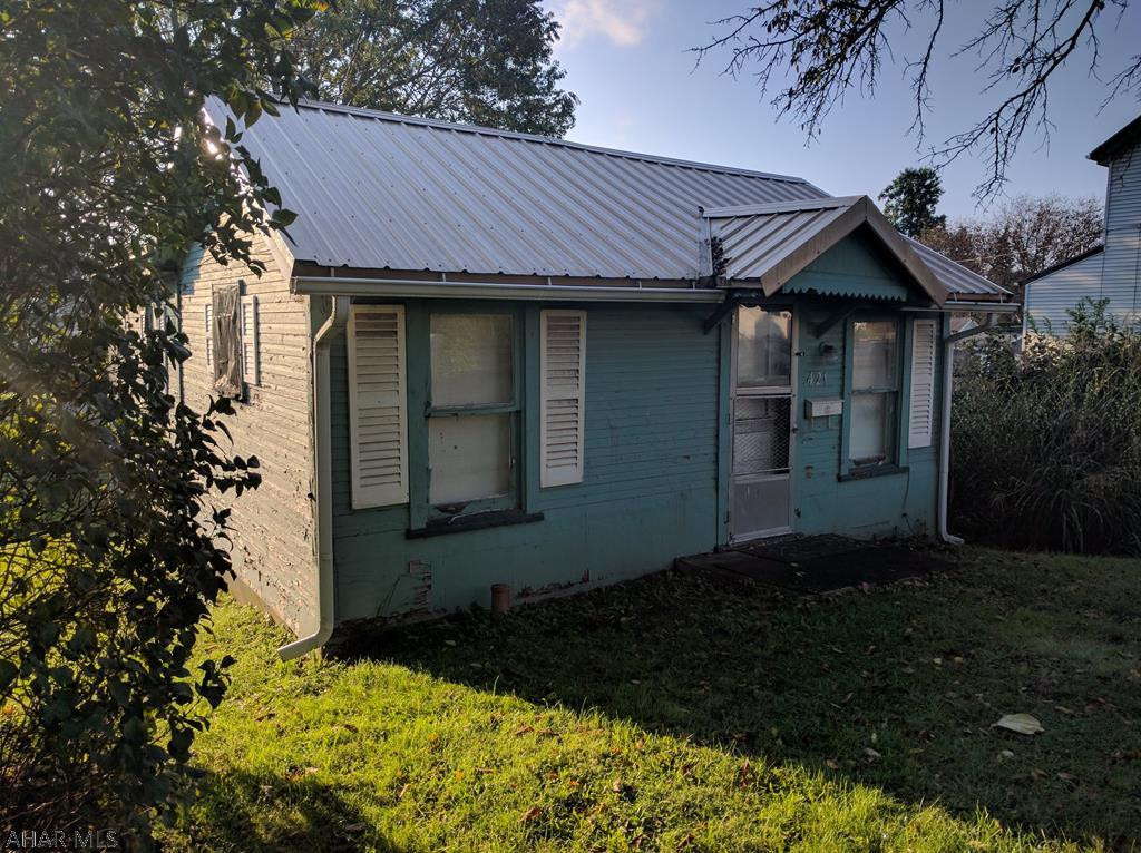 Check out the location of this East End bungalow in need of a Complete Rehab. Beautiful lot. One story home with newer Metal Roof. Property sold AS IS.