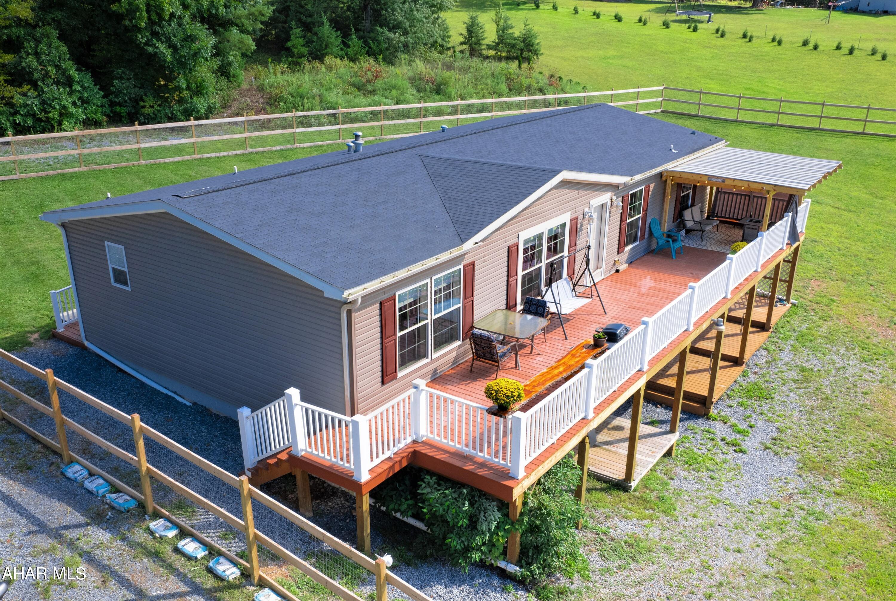 Absolutely beautiful and well-maintained double wide home resting on 7.91 scenic acres. This home offers a large living room open to the kitchen and dining room, owner's bedroom suite with full bath, two additional bedrooms with another full bath, and a first-floor laundry room. Full walk-out basement that would be perfect for future finishing. Heat pump with oil back-up and central air conditioning, private well and private septic system. Huge rear deck for entertaining, relaxing, or just enjoying the expansive country views. Large shed for all your toys or future workshop. Expansive fenced area and modern-day chicken coop on site. Just a short drive to Buchanan State Forest, the MD/PA border, Rocky Gap State Park and Green Ridge State Forest.