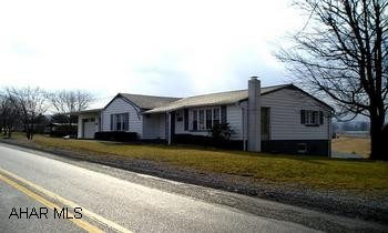 Well-maintained rancher w/ 2 car attached garage.  Newer well and pump; new roof, 2004; rear porch and sidewalks new 2005; new water heater, 2002; new paint, 2007; new retrofit tub in bath, 2006.  Sign in yard.  HOME WARRANTY