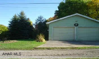 City lot near campus with 2 car garage.