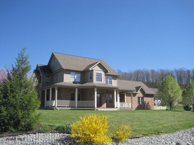 Custom built 2 story featuring 4 bedrooms and 3 1/2 baths.  This unique floor plan offers a quaint breakfast nook, 1st floor den/office, wrap around front porch and ceramic tile foyer.  Recently finished lower level gives the option of library and rec room.  The location and abundance of square footage make this a must see.  The beautiful view is free!