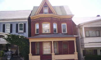 Brick needs some repointing, some soffit fascia work. Natural woodwork on 1st floor.