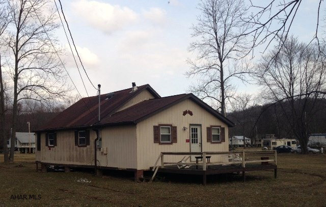 Cottage for summer get-aways or year round living. Located in beautiful Camp Sunshine. Property includes 4 lots that total 0.77 acres. One with an unused, separate well. Two bedrooms plus a loft that could serve as a 3rd bedroom. Needs a little TLC but could easily be ready for summer!