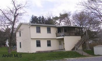Shingle roof, vinyl siding, thermal windows.  Includes 2 stoves, 2 refrigerators, 2 washers and 2 dryers.  Front porch and back porch. Sharp duplex, immaculate condition.  Great back yard.  Off street parking.  Must see interior  Separate laundry rooms, great kitchens and baths.  2 furnaces. 2 electric services.  Rents are $475 and $450.  Renters pay heat and electric.  Owner pays water/sewer and trash.  Directions:  From Rowena Avenue turn on to Wollen Mill Road.