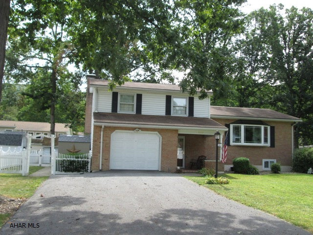 Logan Township/Greenwood - Custom built 4 bedroom with extra features such as rear sunroom and fenced yard. Large family room features wood burning fireplace. This well built home is located in one of the finest areas of Logan Twp. All appliances stay, home warranty included.