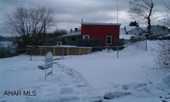 Updated home with good mechanics and move in ready. Large master bedroom, rear deck, pool and garage. Very well maintained 2 to 3 bedroom house with 2 (50x120) parcels. City plows alley. 2 Tax ID numbers. 1-1-2-180 and 1-1-2-179