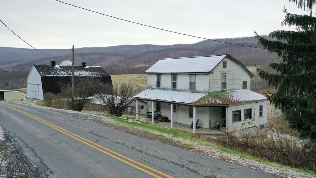 This picturesque farm is situated in Milligans Cove and rests on 259.87 acres!! Property offers rolling fields, woods, a large pond, and scenic views. Older farmhouse that could be rehabbed or razed for your new dream home overlooking fields and mountains. 48' x 60' bank barn, silos, and other outbuildings. Can be a working farm, weekend getaway for ATVing or hunting or your permanent residence for peace and quiet. Situated close to White Sulphur Springs Conference Center, State Lands and an easy drive to Maryland, I-68, the PA Turnpike and I-99.