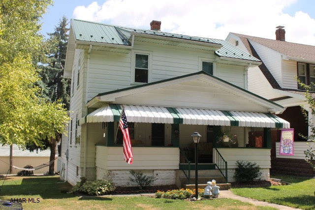 Charming and well maintained home in the desirable Pleasant Valley area. You enter into the living room with gas fireplace and quaint dining room with wainscoting. The kitchen has an eat-in area with bonus room that leads to a balcony overlooking the yard. The 1st floor master bedroom has 2 closets and full bath. The 2nd floor offers 2 large bedrooms with hardwood floors and another full bath. Family room addition in lower level for extra entertaining space with walkout to large detached 1.5 insulated garage with electric and workshop area.  Call the listing agents today!