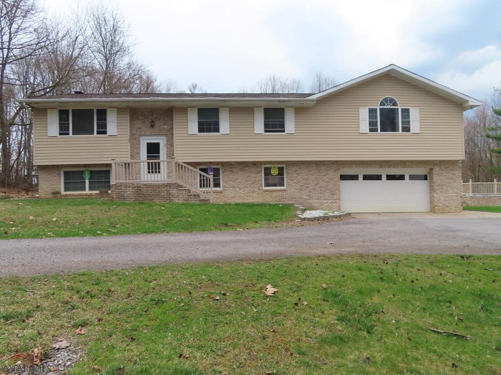 Very Nice Home on 6 acres. 3 Bedroom Bi Level with finished basement and built in 2 car garage. This home it set up to entertain with a nice kitchen and walk out patio down to the pool, yard and fire pit. Its great place to enjoy your nights out side. When it gets cold out there is also a great space in the basement with a finished den and rec room with bar and bathroom.