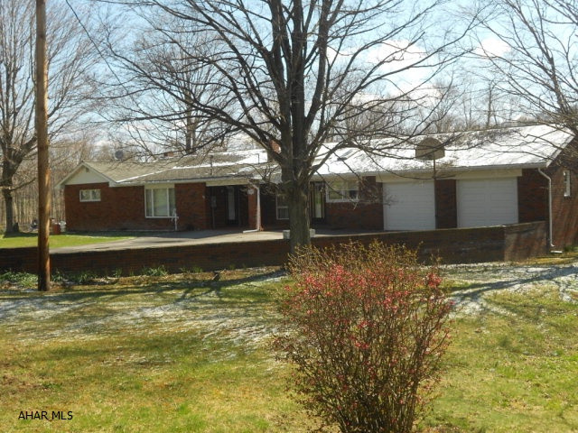 Entertaining, office space, large garages, in ground heated pool all a part of this full brick rancher. This home is well built with many upgrades and filled with lots of love. Attached 2 car garage, breezeway and huge living room. Basement has a family room with wood fireplace. New heat pump in 2015. Thermal pane windows and lots of storage space and nice yard space. Huge detached garage space and paved driveway. So much to offer for a great price!