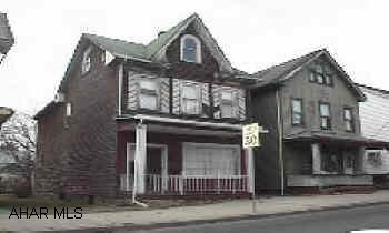 Large home with 3-4 bedrooms, 2 full bathrooms, attic.  Needs work.