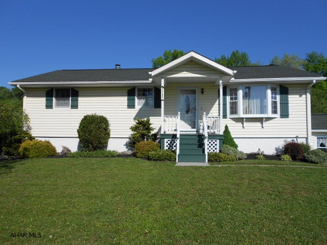 One level living in this well built, clean inside and out. (IMMACULATE) Well maintained single owner home with three heat sources Electric, Coal and Wood. The 7+ acreage offers Barn, Corral/Stables, Pond, Beautiful view, Two wells and a MUST see replica of the house from the TV show Little House on the Prairie. Don't miss out on this one!!!!!!!! The 24X32 garage offers Electric, Water and Storage above. You can fit four cars in this garage.