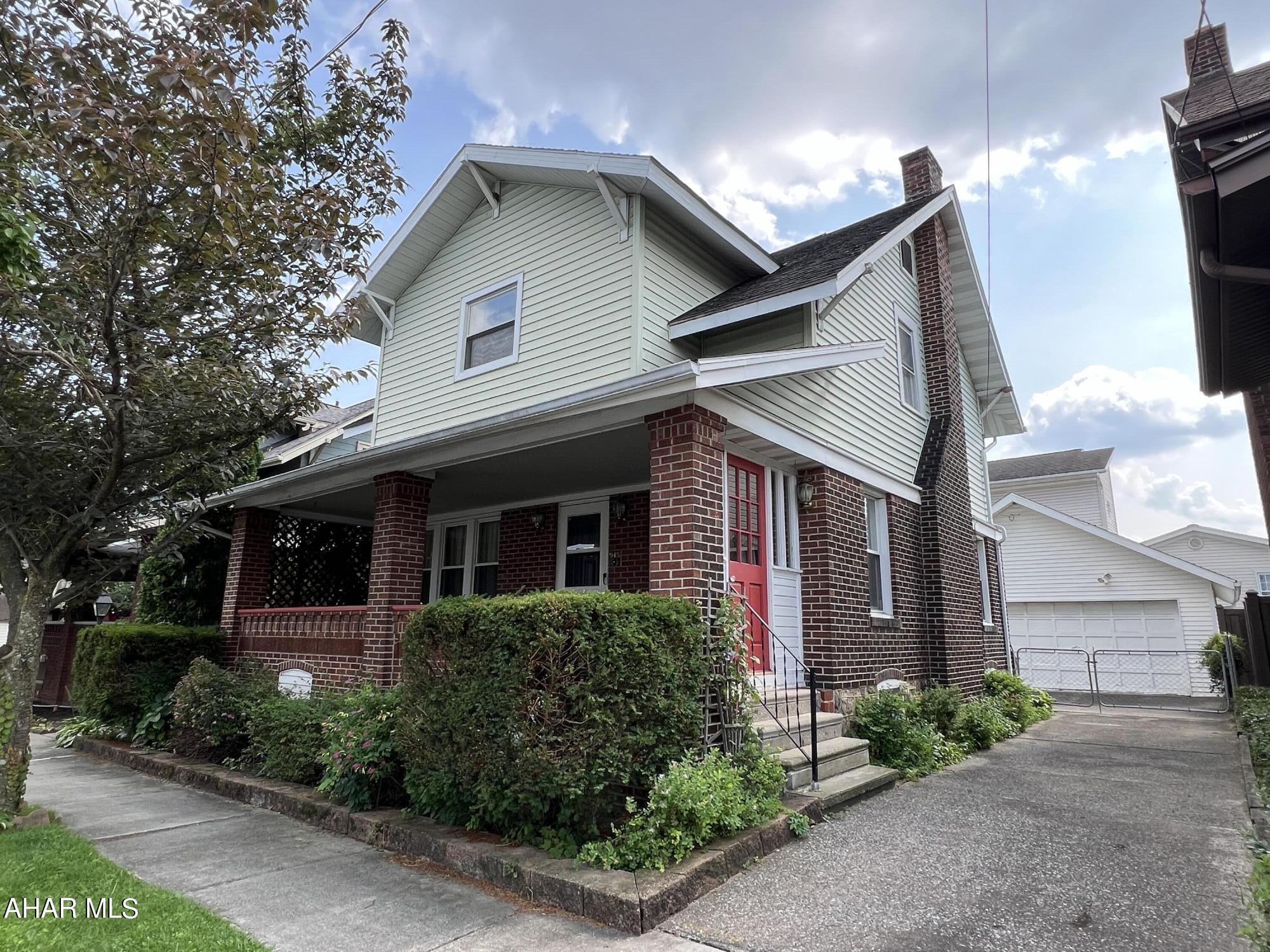Bring some imagination to this spacious property and it will be spectacular for your first home. The exterior is virtually maintenance free and you will love that front porch! Three bedrooms, 1-1/2 baths, some original hardwood floors, garage and fenced yard are some of the great features that this home offers. Call for a showing!