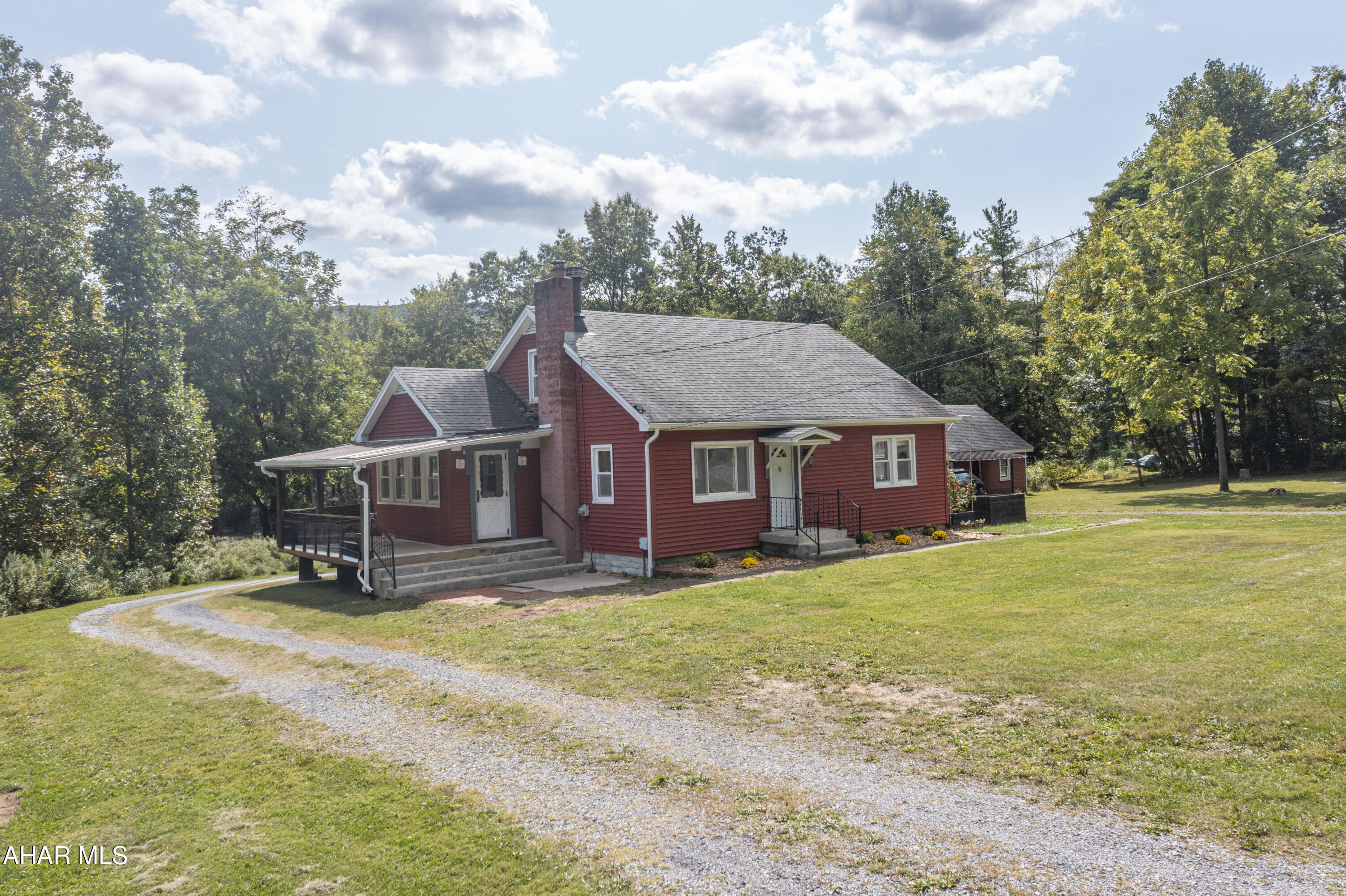 This charming 1.5-story home has the perfect blend of character, comfort, and country living! Featuring 3 bedrooms (with the potential for a 4th), you'll love the flexibility of having 2 bedrooms and a full bath conveniently located on the first floor, with additional bedrooms upstairs. Original hardwood floors, a cozy fireplace, and an updated kitchen add warmth and style throughout.

Just off the kitchen, you'll find a bright, light-filled room with plenty of windows—ideal as a dining room, sunroom, or even a mudroom, depending on your needs.

Set on approximately 3.42 acres, the property offers a quaint country setting with wooded views at the back, a wrap-around driveway and 5 raised garden beds. Enjoy quiet mornings on the covered side porch swing or gather around a fire on crisp evenings.

Car lovers, hobbyists, or anyone needing extra space will be thrilled with the oversized 3-car garage—complete with electric, built-in cabinets, shelving, and even a walk up second floor for storage.


Spacious closets, move-in-ready condition, and the desirable Sinking Valley location make this home a rare find you won't want to miss!