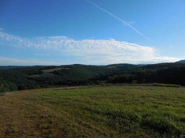 Amazing views! All rights convey. Wooded and open.
