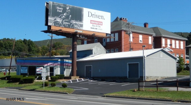 Spacious 6700 Sq. Ft. building with showroom and loading dock/warehouse; the owner will rent or sell building; very visible location- great traffic count. $3500 per year sign rent paid to seller...Approx. 12 years remaining.