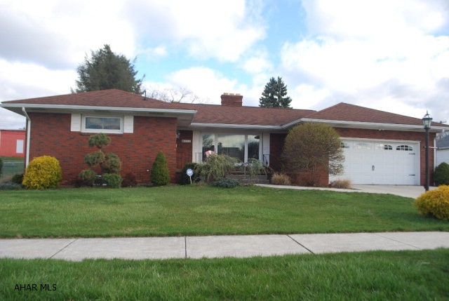 IMMACULATE 3bd 1.5ba brick ranch home in the heart of Roaring Spring!  Beautiful hickory kitchen with granite tops and ceramic back splash!  This 1 story living offers many amenities that include central vac, central air, home humidifier as well as whole house fan and much much more!  HUGE family/rec room in basement with gas fireplace and newer carpet. In addition, this beauty offers a 2 car attached garage with openers and covered rear patio for entertaining!  Don't miss!