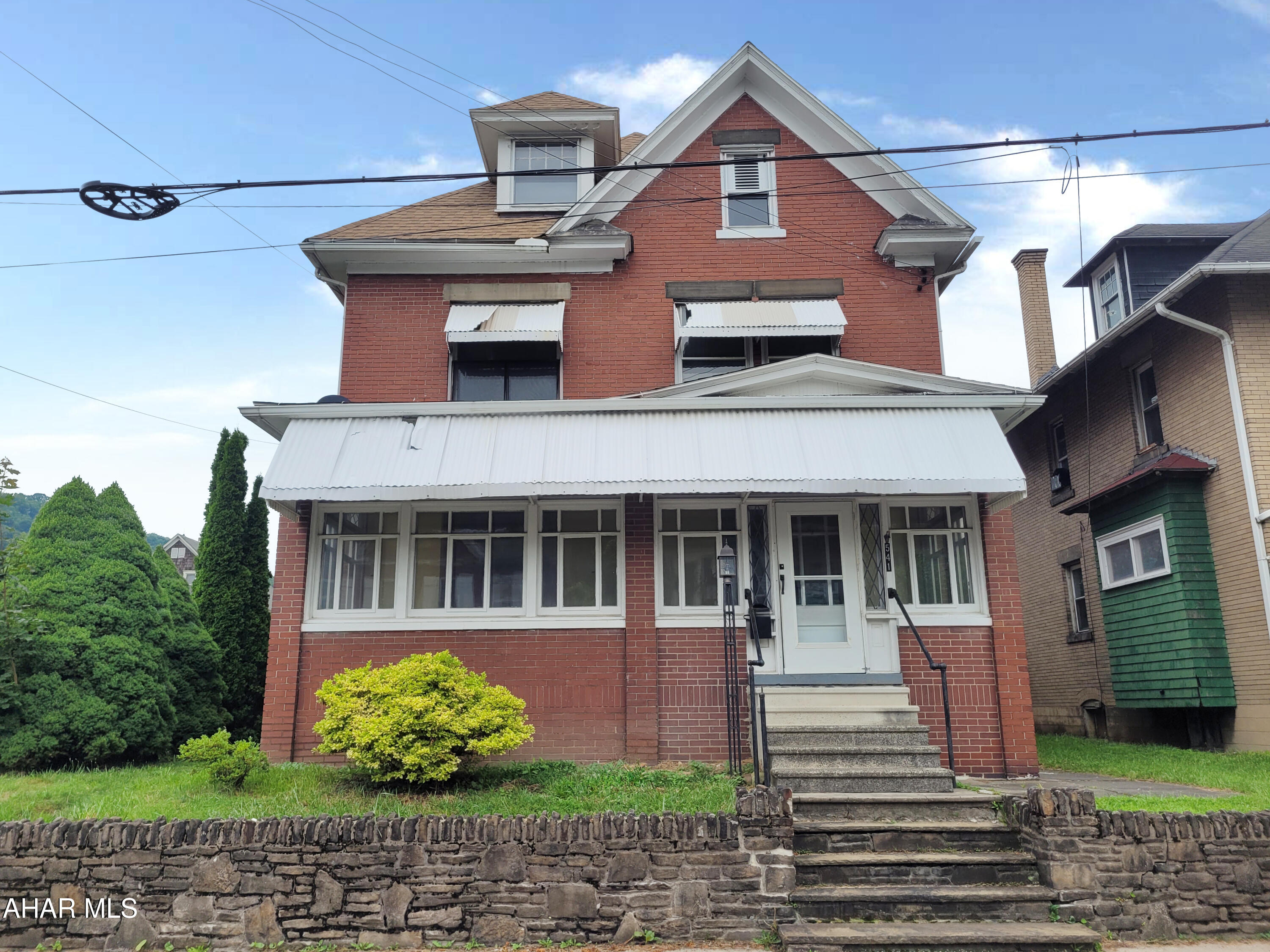 This inviting property offers a perfect blend of character and functionality with spacious rooms, high ceilings, and classic woodwork throughout. The bright and airy living room flows into a formal dining area, ideal for entertaining. The kitchen features ample cabinet space and a cozy breakfast nook. Upstairs, you'll find generously sized bedrooms and a full bath. The lower level includes a basement with a laundry area. Enjoy your mornings on the covered front porch or unwind in the  level backyard. Off-street parking and a detached garage complete this package. Conveniently located near schools, parks, and local amenities.