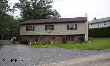 MINUTES FROM MALL YET SECLUDED. BEAUTIFULLY LANDSCAPED WITH A FISH POND. ABOVE GROUND POOL WITH DECK. DOES NEEDS SOME CARPET.