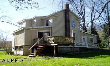 2 Story Frame/vinyl 7 room 2BR/1BA home on large lot, public water and sewer, 14 x 28 outbuilding. Being sold as is. Living room, dining room, kitchen, family room, bonus room, 2BR, full bath with jacuzzi tub.