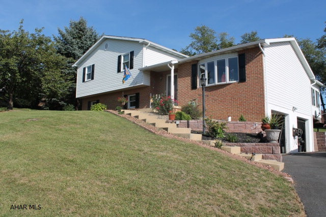 Must see move in ready split level in Rolling Hills Estates.  Freshly painted interior, with spacious updated kitchen, dining area and living room from which you can see historic Hollidaysburg and the mountains beyond. From the main level you can exit into your three season sunroom then onto your deck and stone patio area all overlooking a private backyard.  The kids bedrooms are spacious and the master bedroom comfortably accommodates a king size bed. The family room features a gas fireplace and carpeted floors.  Also on the lower level is a half bath and laundry area.