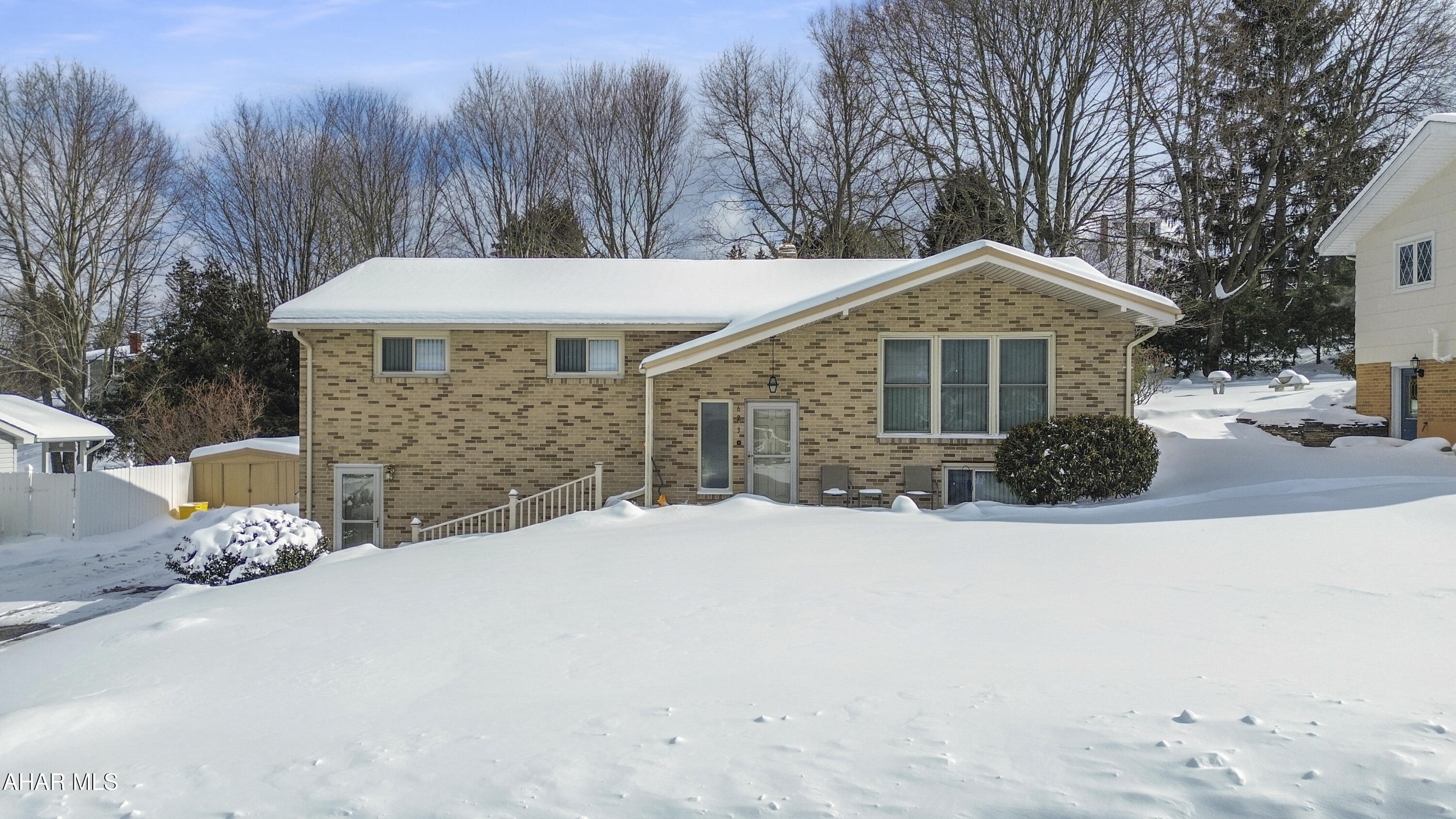 Welcome to 623 Sherman Street in the Portage Area School District. This well maintained all brick split-level home is tucked away on a quiet street & offers an excellent layout with generous living space throughout. The main level features a bright & spacious living room filled with natural light, a dining room with sliding glass doors leading to the rear deck, a roomy kitchen with included appliances, two nicely sized bedrooms, a full bathroom, & a primary suite complete with a convenient half bath. The fully finished lower level adds even more versatility, offering a large family room with a pool table & wet bar, an additional living area or potential fourth bedroom, a full bathroom, & a dedicated laundry area. Outside, enjoy off-street parking, a storage shed, a large private yard, ample deck space for entertaining, & a newer metal roof. Schedule your showing today!