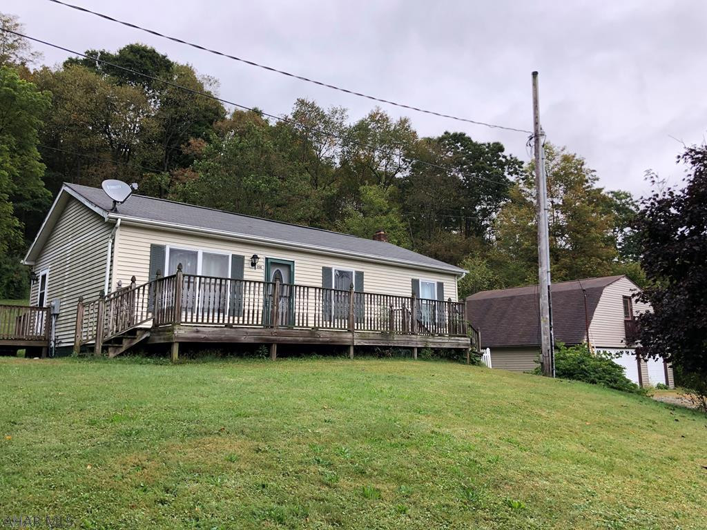 Enjoy the outdoors while living in town on this dead end street.  Sitting on almost an acre, this 3 bedroom 1.5 bath home has newer furnace and hot water heater.  Entertain family and friends downstairs in this unique space.  Also features a large oversized 3 car garage to store all of your vehicles, convert the upstairs of the garage into additional family living space.  Natural gas tap is available if you would want to switch.  Don't miss your chance at this one. Call today!